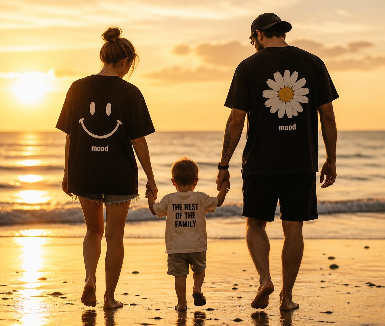 A family wearing Mood Merch while walking together on the beach