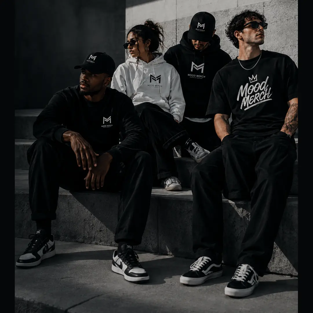 Four models wearing black and white Mood Merch apparel